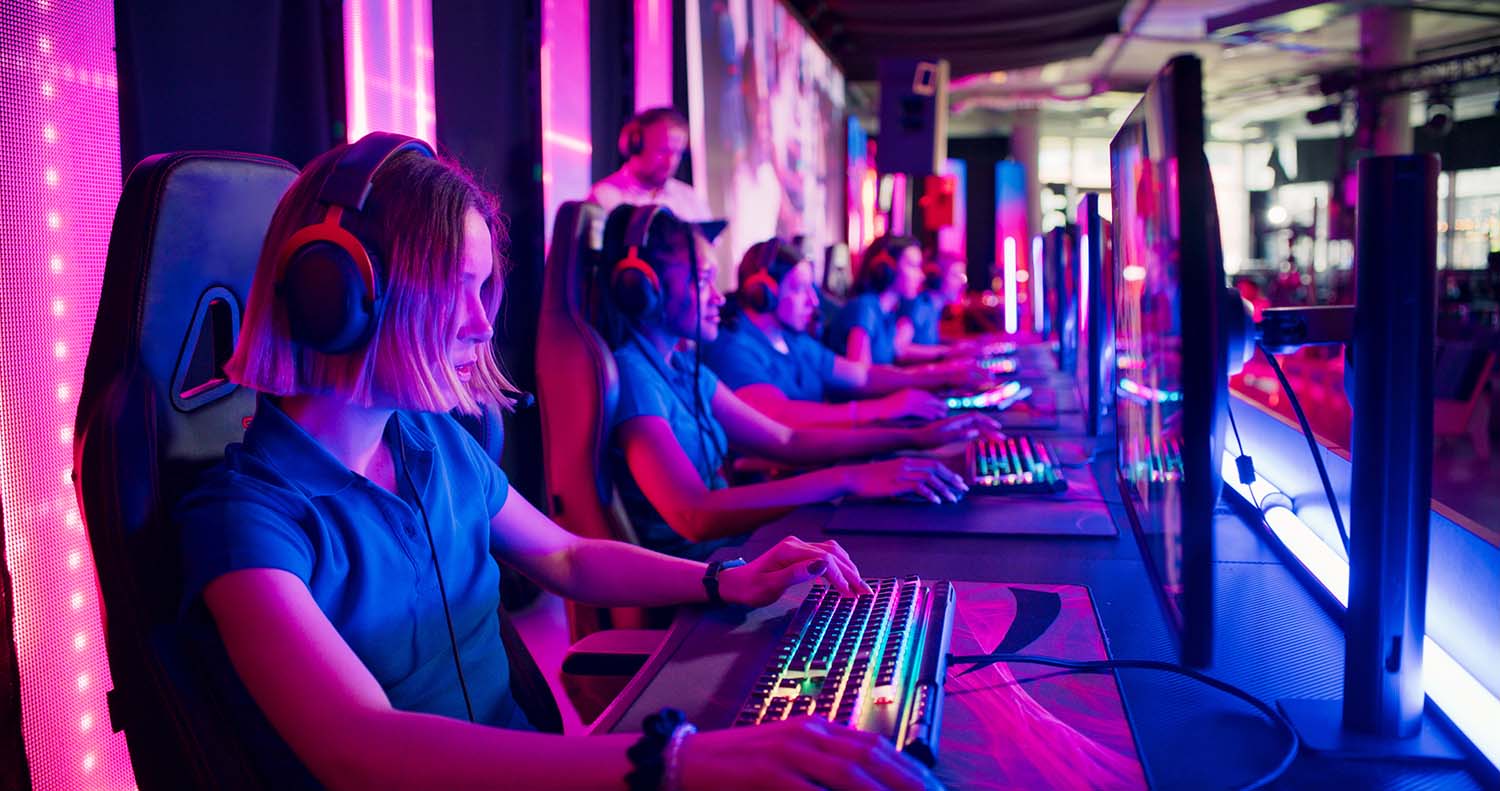 Futuristic esports arena in 2025 with digital AI leaderboards displaying real-time gaming stats above a cheering crowd